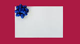 Illustration of blue Christmas bow on the white card isolated on purple background