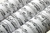 Three music sheets on a row isolated in white