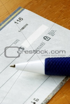 Writing a check to pay for the bill