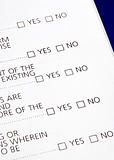 Select Yes or No from a questionnaire isolated on blue