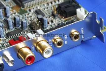 Close up view of a sound card isolated on blue