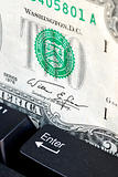 Two dollar bill and keyboard concept online shopping or banking