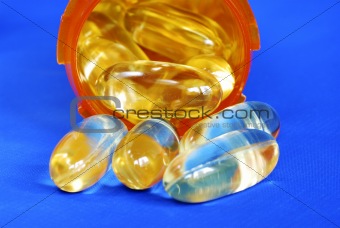 Close up view of some pills isolated on blue