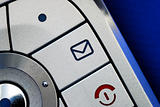 Close up view of the email symbol in the cellular phone isolated on blue