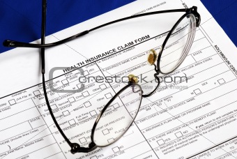 Fill the health insurance claim form isolated on blue