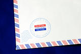 Part of the airmail envelope isolated on blue