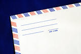 Part of the airmail envelope isolated on blue