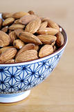 Some almonds on a small Japanese bowl