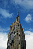 Empire State Building in New York City with a blue sky