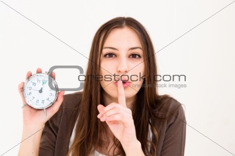 woman holding alarm clock