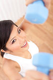 Beautiful Young Asian Chinese Woman Lifting Weights at Gym