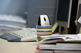 Computer mouse inside a mug