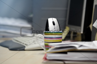 Computer mouse inside a mug