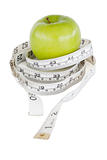 Green apple circled with a tape measure
