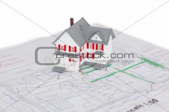 Toy house model on a plan