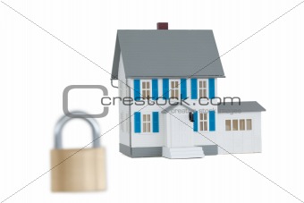 House locked with padlock against a white background 