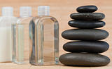 Close up of glass flasks and a black stones stack