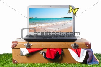 laptop on suitcase