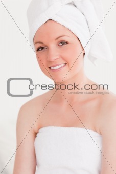 Beautiful young woman wearing a towel