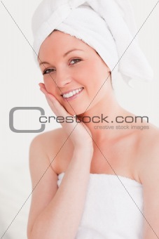 Attractive young woman wearing a towel