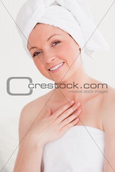 Pretty young woman wearing a towel