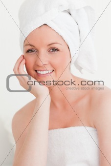 Beautiful young female wrapped in a towel