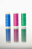 Colorful spools of thread on a table