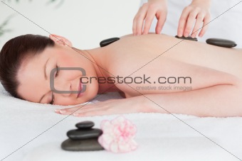 Young woman receiving LaStone therapy