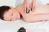 Beautiful young woman having a LaStone therapy
