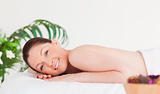 Smiling woman on a massage table