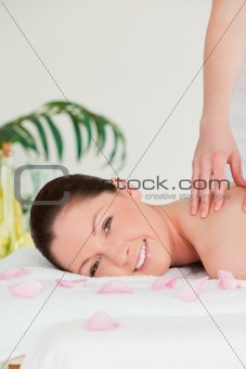 Portrait of a woman receiving a massage in a spa