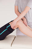 Athletic woman having a leg massage