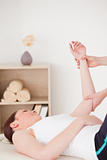 Portrait of a young woman having an arm massage