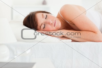 Cute brunette female having a rest while lying