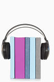 A stack of books and headphones