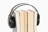 Close up of a stack of books and headphones