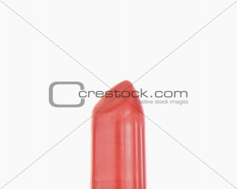 Close up of a pale red lipstick