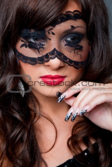 attractive brunette with  acy mask on eyes