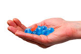 blue candies in a hand