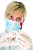 female doctor with mask holding a syringe