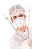 doctor with mask holding sticks