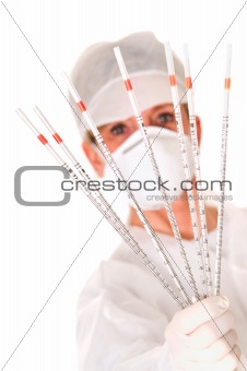 doctor with mask holding sticks