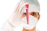 female doctor with mask holding a test tube