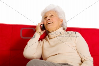 elderly woman on the couch with mobile