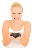 Woman with blueberries in hand