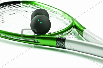 Green squash racket with balls on white
