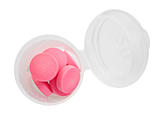 Pink pills and pill bottle on white background