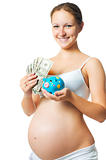 pregnant woman with a piggy bank