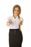 Young business woman showing thumbs up