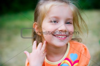 Cute little girl  on the meadow
